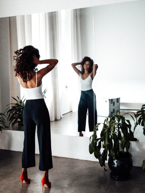 Leah Brathwaite laughing in the mirror