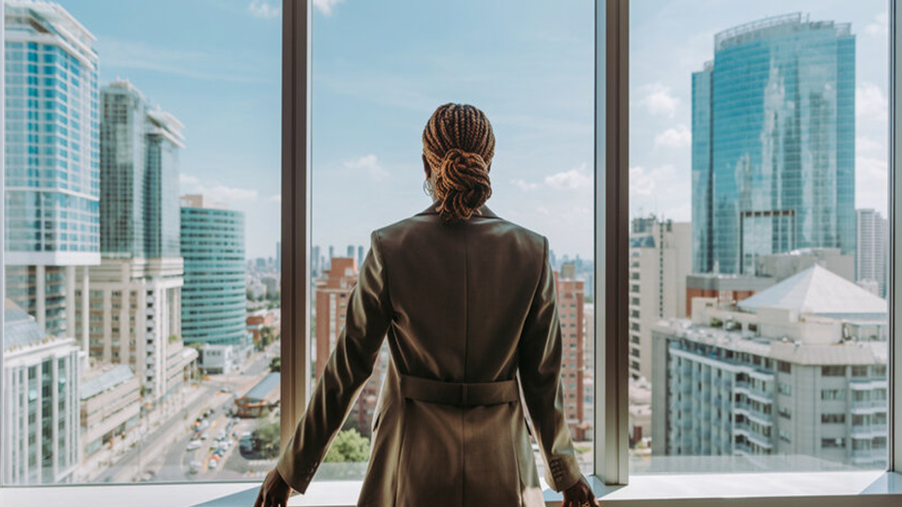 high achiever taking a pause looking out window