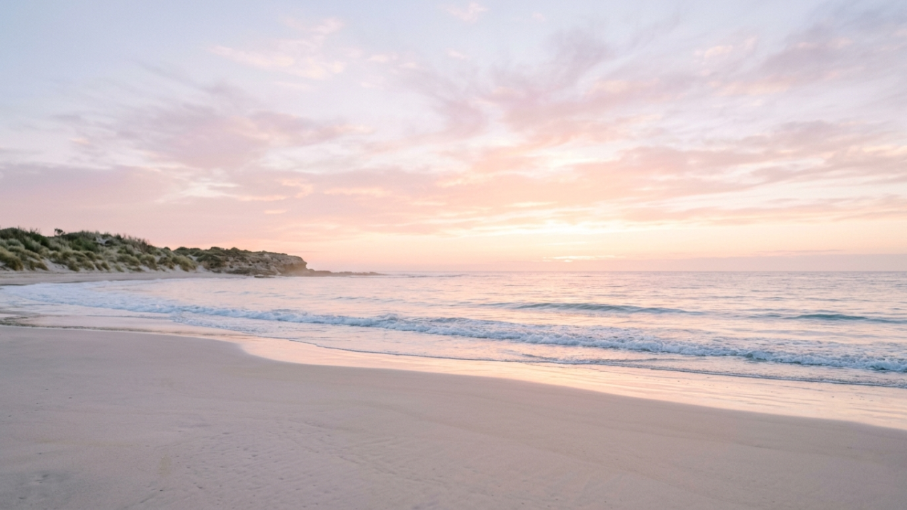 Peaceful coastal sunrise with gentle ocean waves, soft pastel skies, and a calm relaxing atmosphere symbolizing hope and new beginnings
