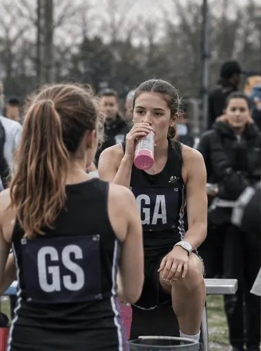 Netball players at a break in play