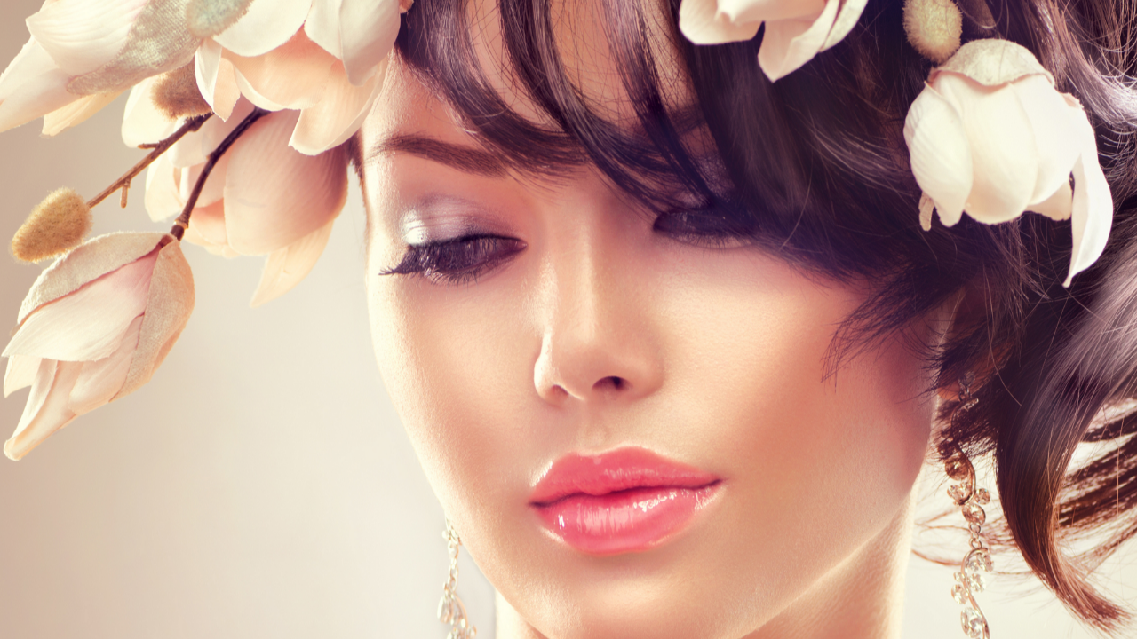Nostalgic Bride personality portrait featuring a romantic brunette bride with soft vintage-inspired makeup, delicate floral crown, elegant earrings, and timeless feminine beauty.