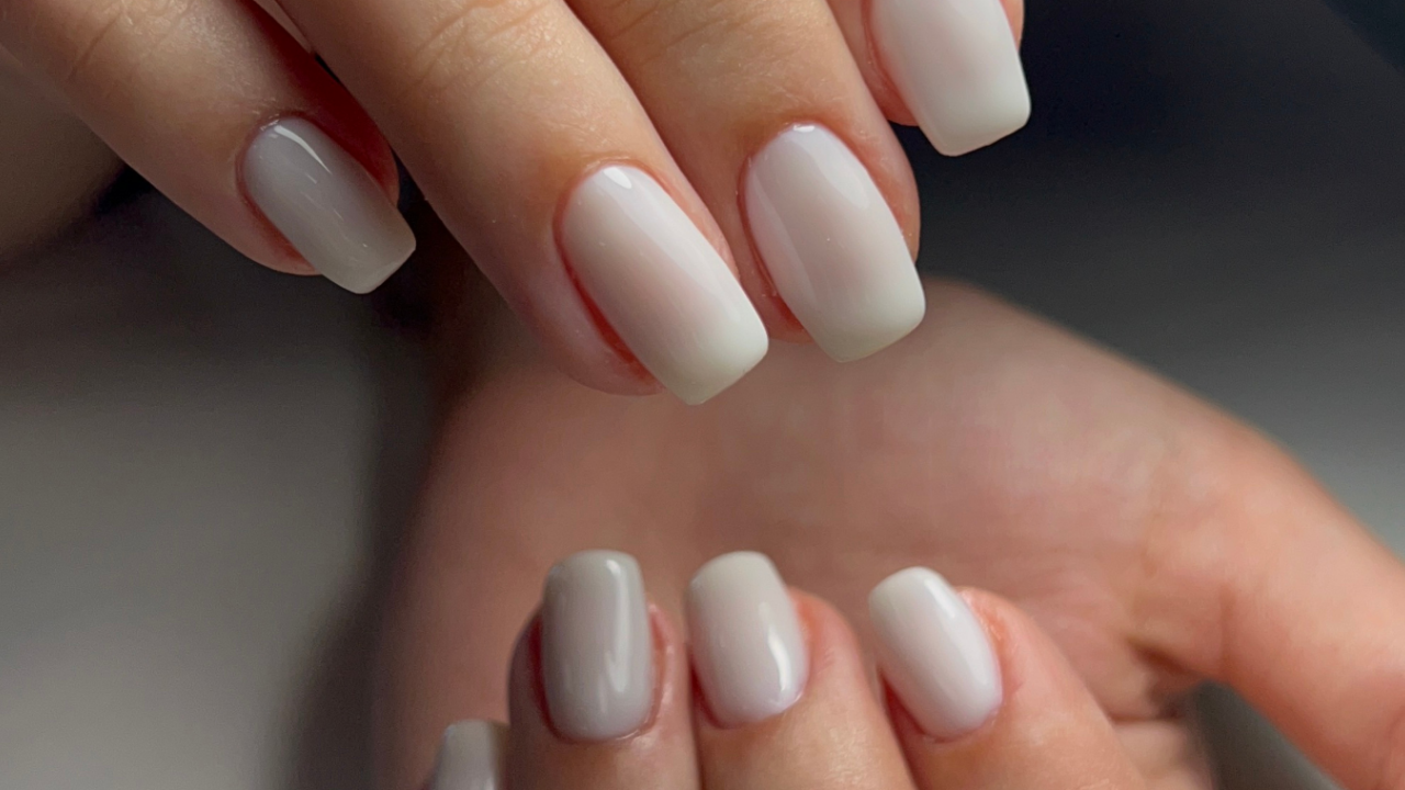 Mother of the Groom Nails — Close-up of neatly manicured hands with soft neutral polish, showing a clean, elegant, and timeless nail style.