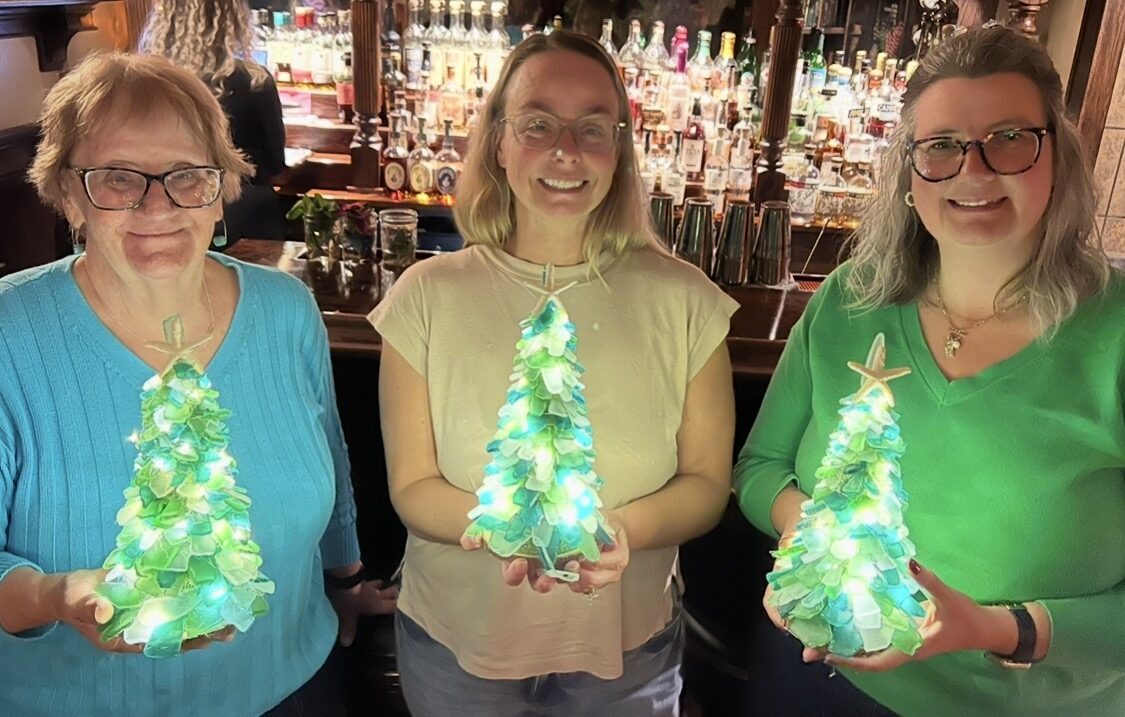 A group making sea glass trees at an in-person Artist at Heart event in Cleveland