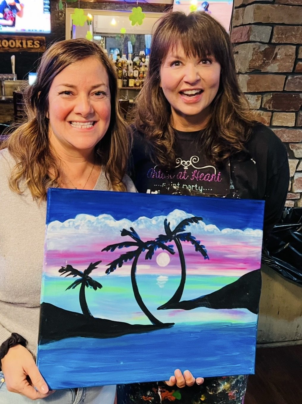 Guests at an Artist at Heart paint and sip party in Cleveland
