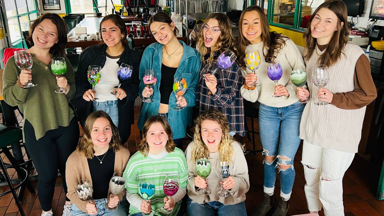 Wine glass painting paint and sip activity in Cleveland