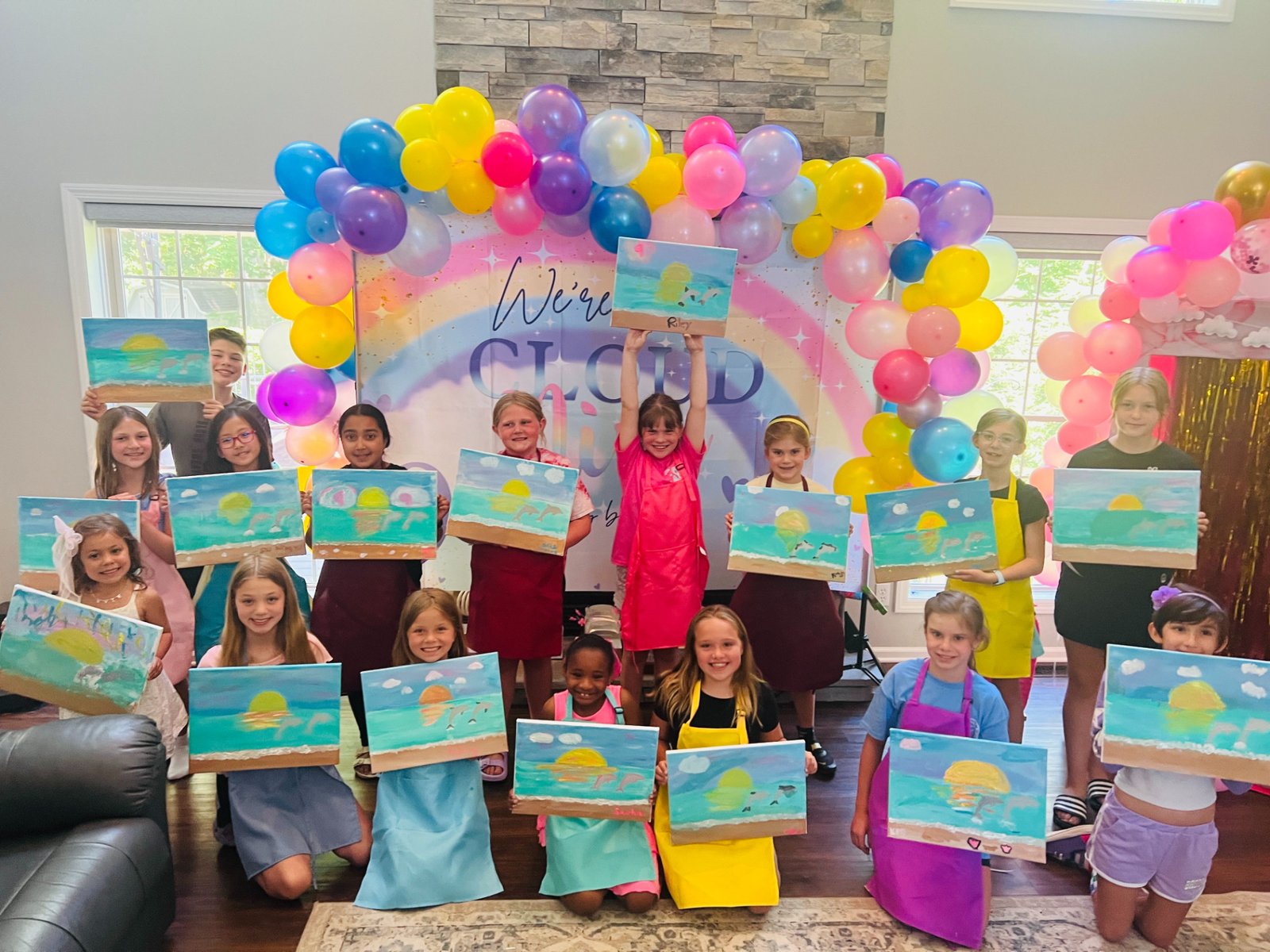 Kids painting at an Artist at Heart paint and sip party in Cleveland
