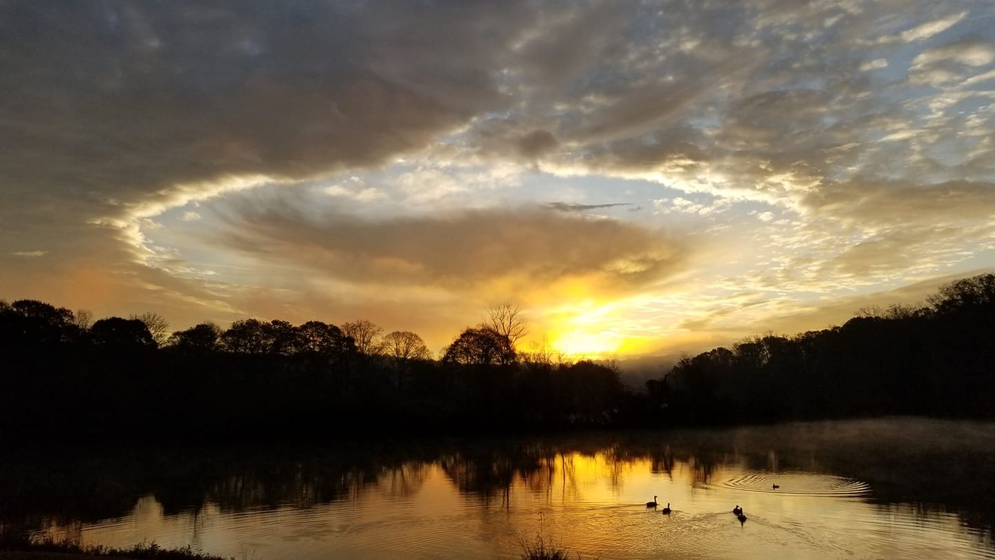 Hole punch cloud over a lake at sunrise, conformation training, conformation dog shows, dog training, dog show training, conformation seminars, Sandy Weaver