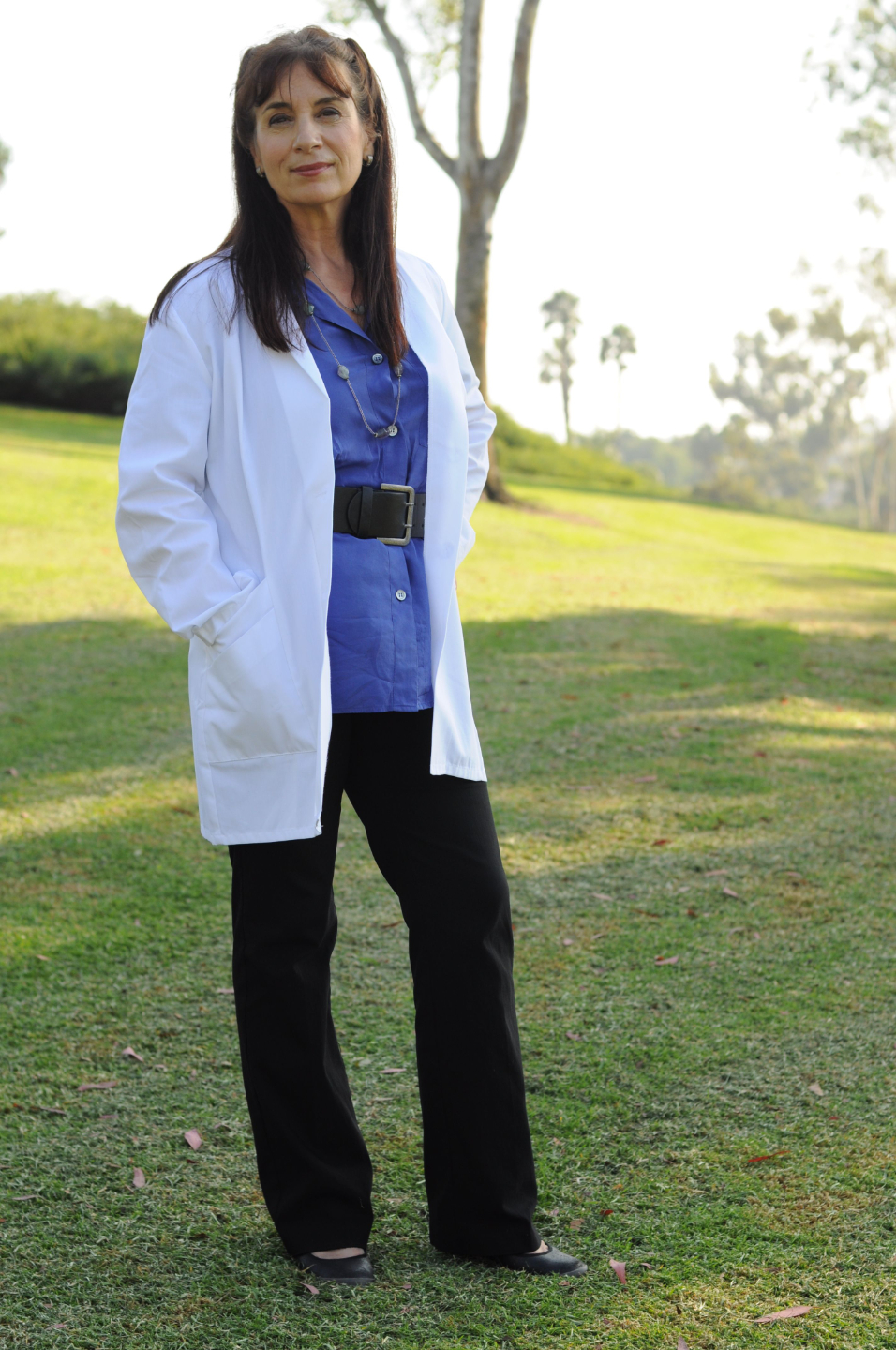 Dr. Anastasia Chopelas, physicist and master healer, in a white lab coat