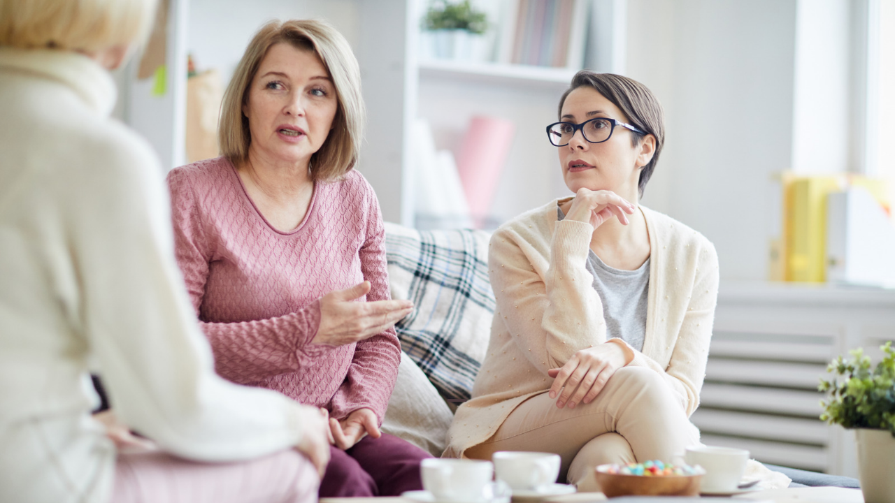 Women talking on a couch