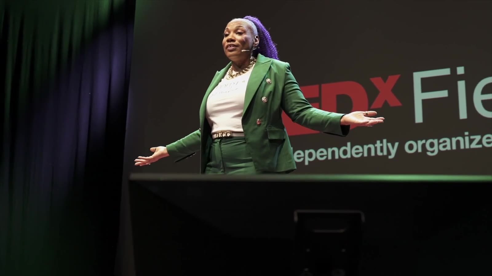 Shameca Tankerson speaking on the TEDx Fiesole stage