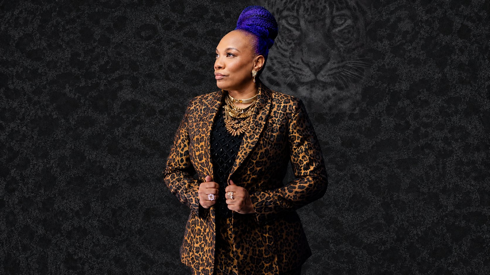 Shameca Tankerson in a leopard print suit with gold jewelry