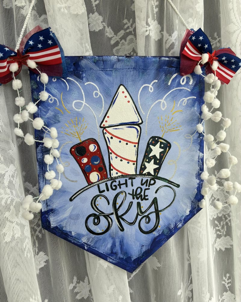 Hand lettered 'Light Up the Sky' patriotic banner, made by a student