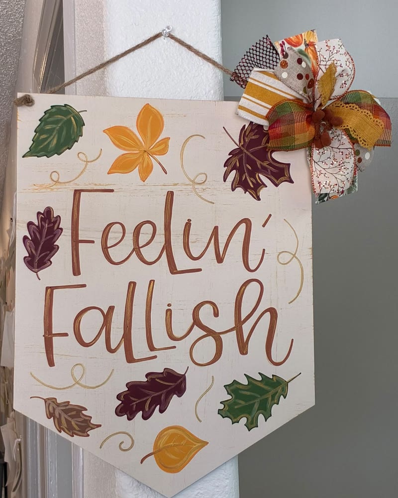 Hand lettered 'Feelin Fallish' banner with leaves, made by a student