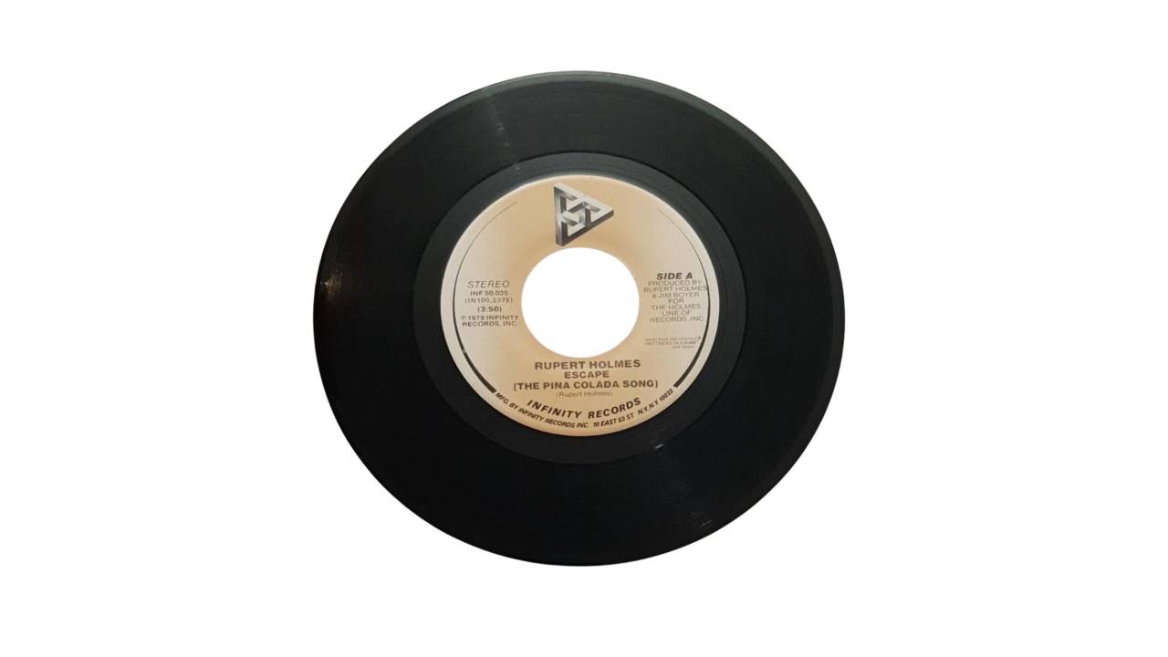 45 record of Escape (The Pina Colada Song) by Rupert Holmes