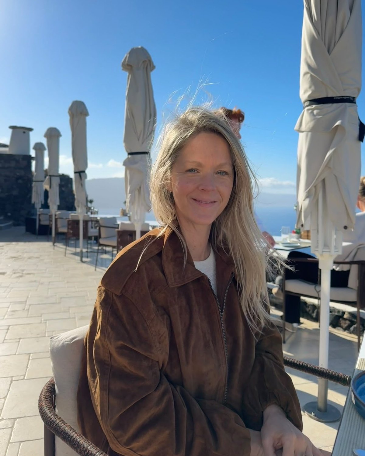 Kate Harlow on a sunny terrace in Paris