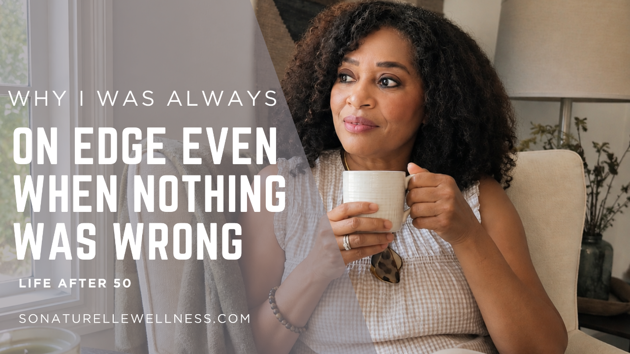 Woman sitting peacefully by a window holding a cup of tea while reflecting on chronic stress and feeling constantly on edge.