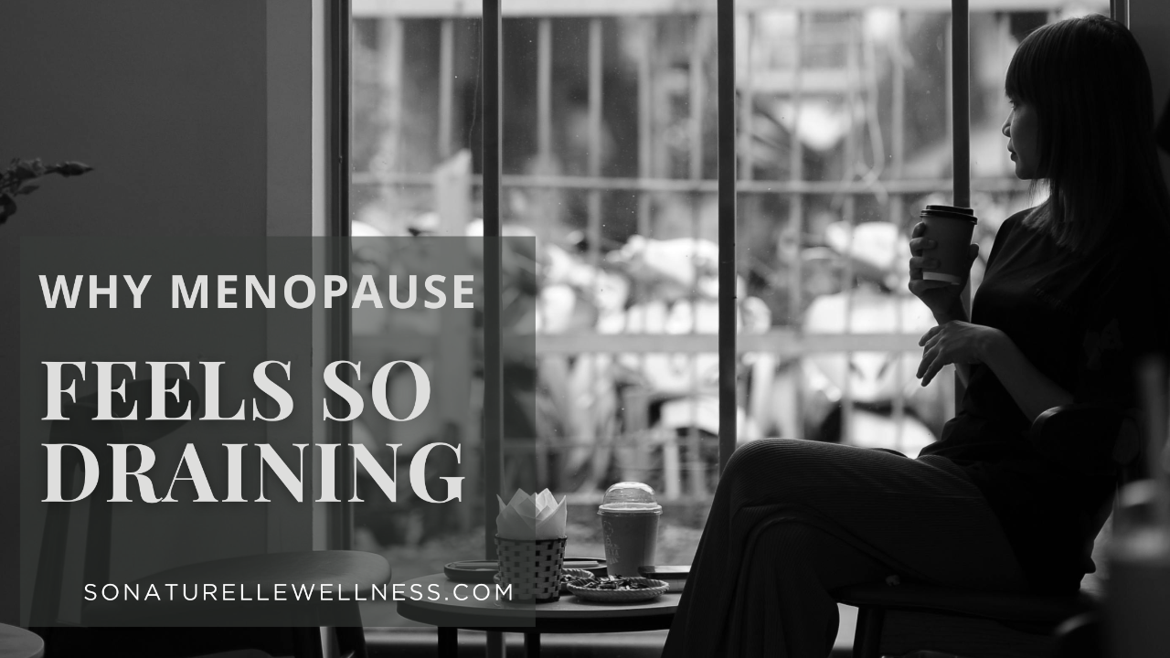 Woman in midlife sitting quietly by a window reflecting on emotional and physical exhaustion during menopause