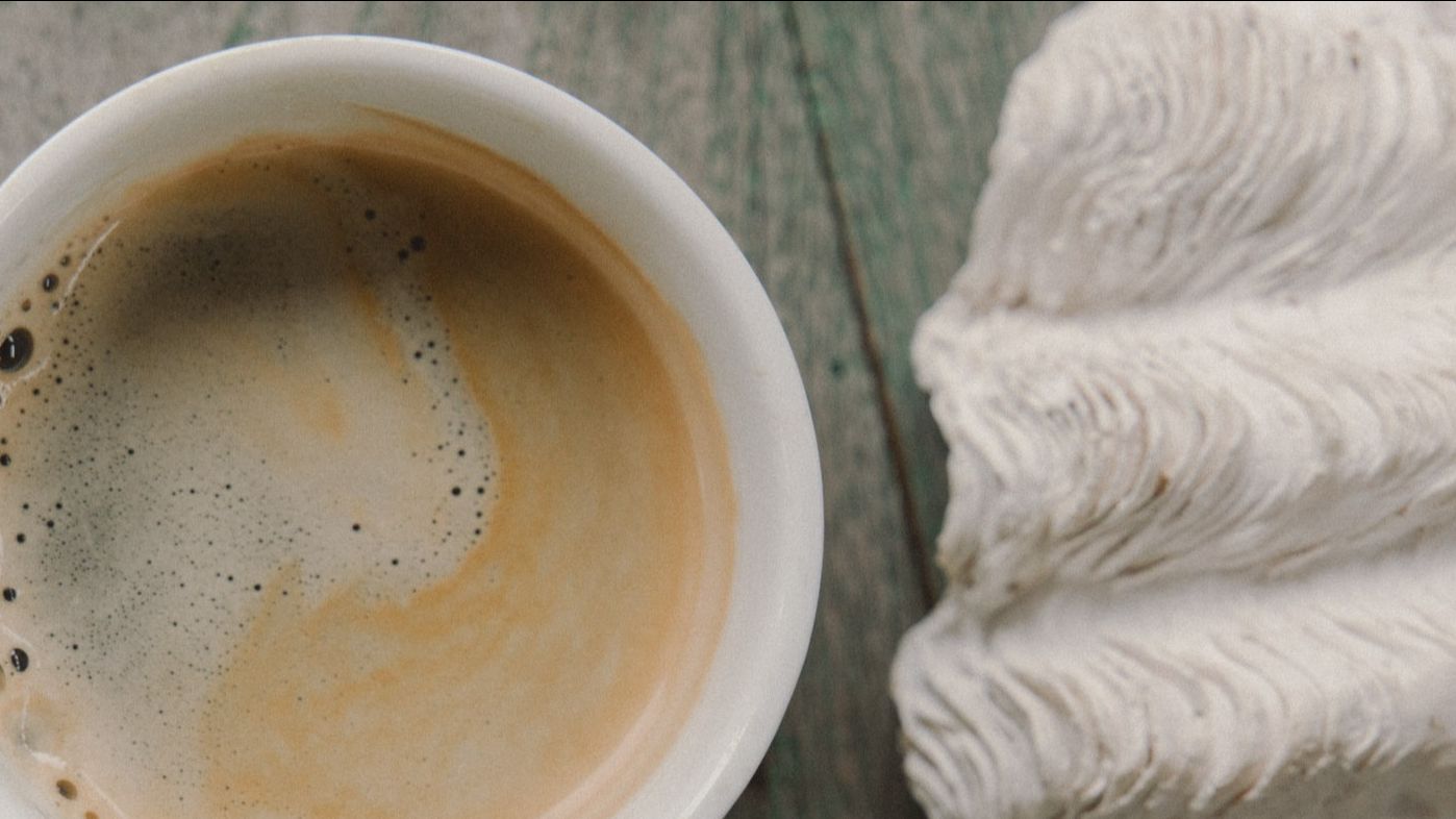 Espresso coffee with cream and meringue cookies