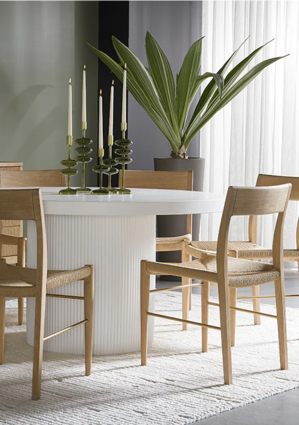 Minimalist wooden side table next to a modern chair, representing thoughtful design and simplicity in home decor.