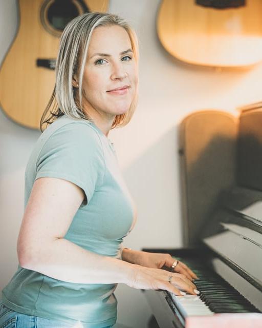 Whitney at the piano in her studio
