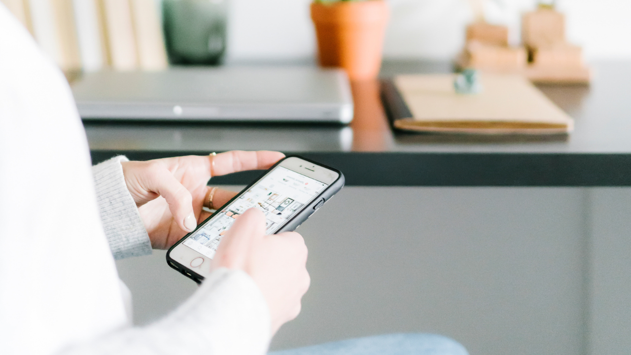 close-up of woman scrolling on a phone