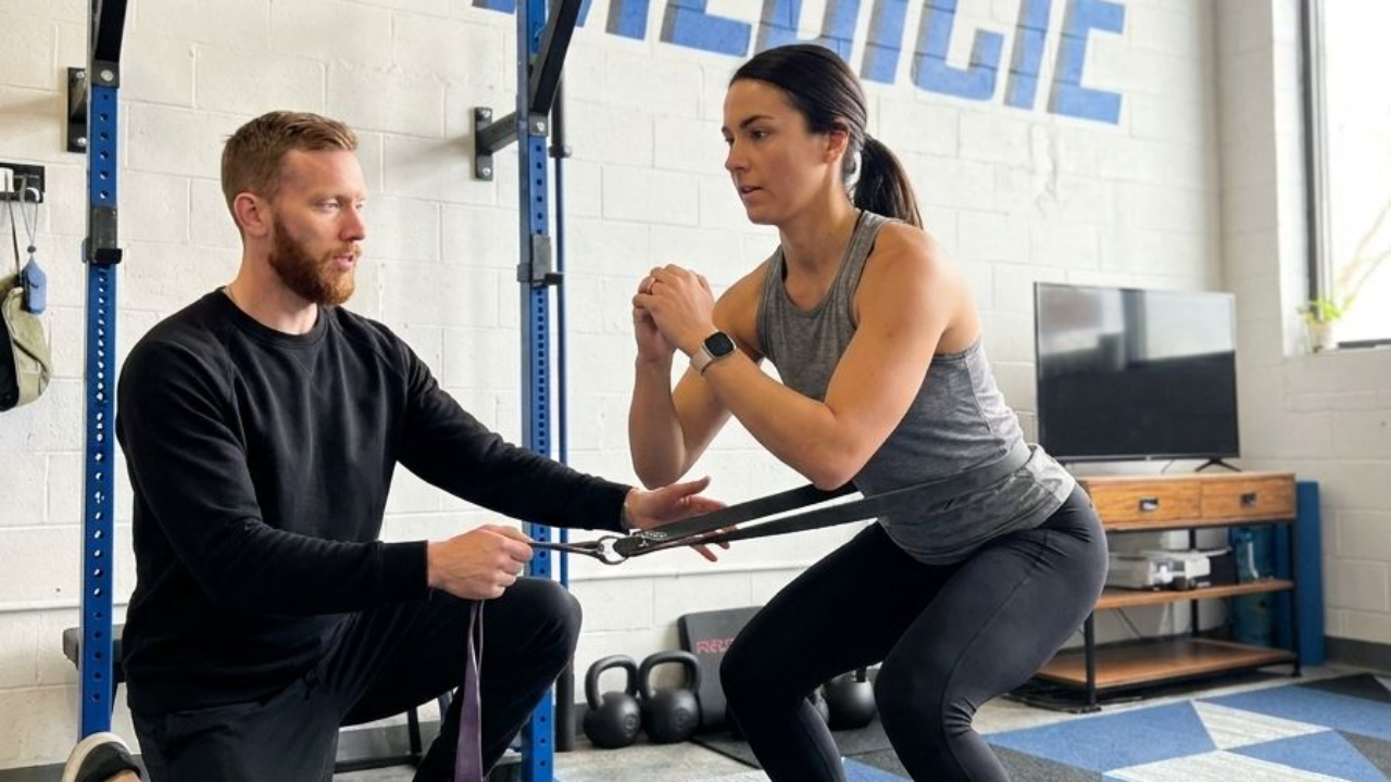 Patient undergoing a functional movement assessment with a physical therapist at a performance physical therapy clinic in Decatur, GA