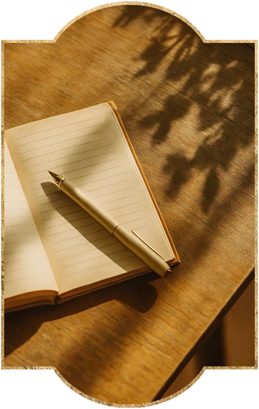 An open journal and pen in golden light