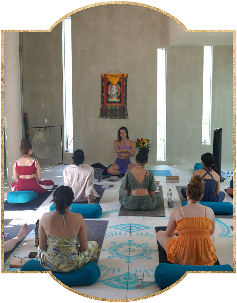 Bela teaching a circle of women