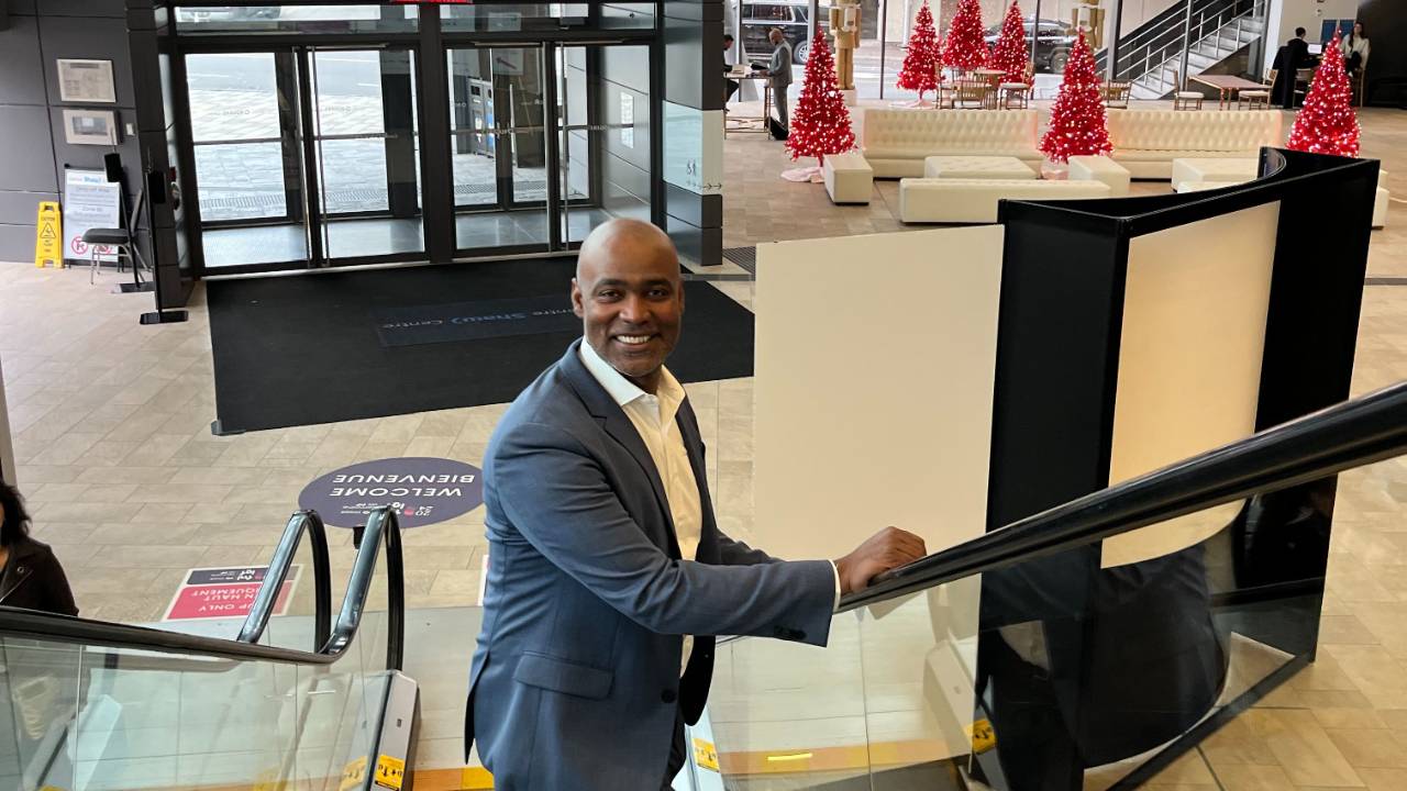 Ivan riding an escalator at a major convention center in Ottawa