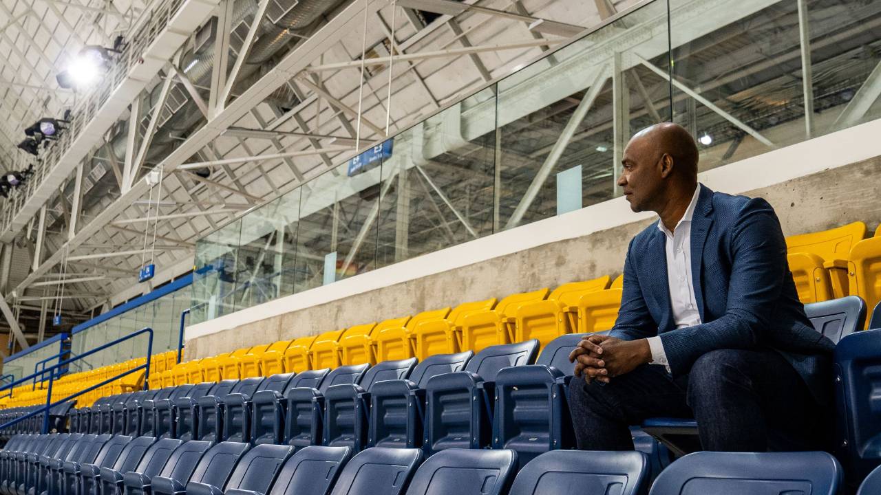 Coach Ivan sitting in the stands