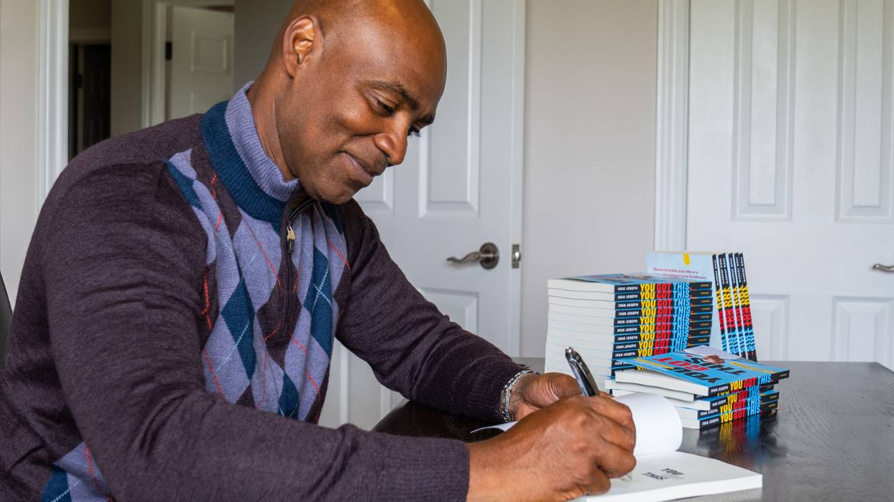 Ivan autographing copies of his book, "You Got This: Mastering the Skill of Self-Confidence"