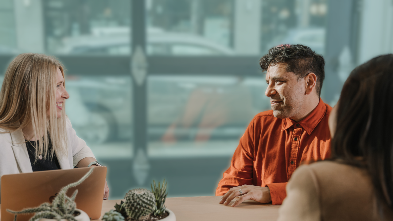 Two people sitting at a conference table