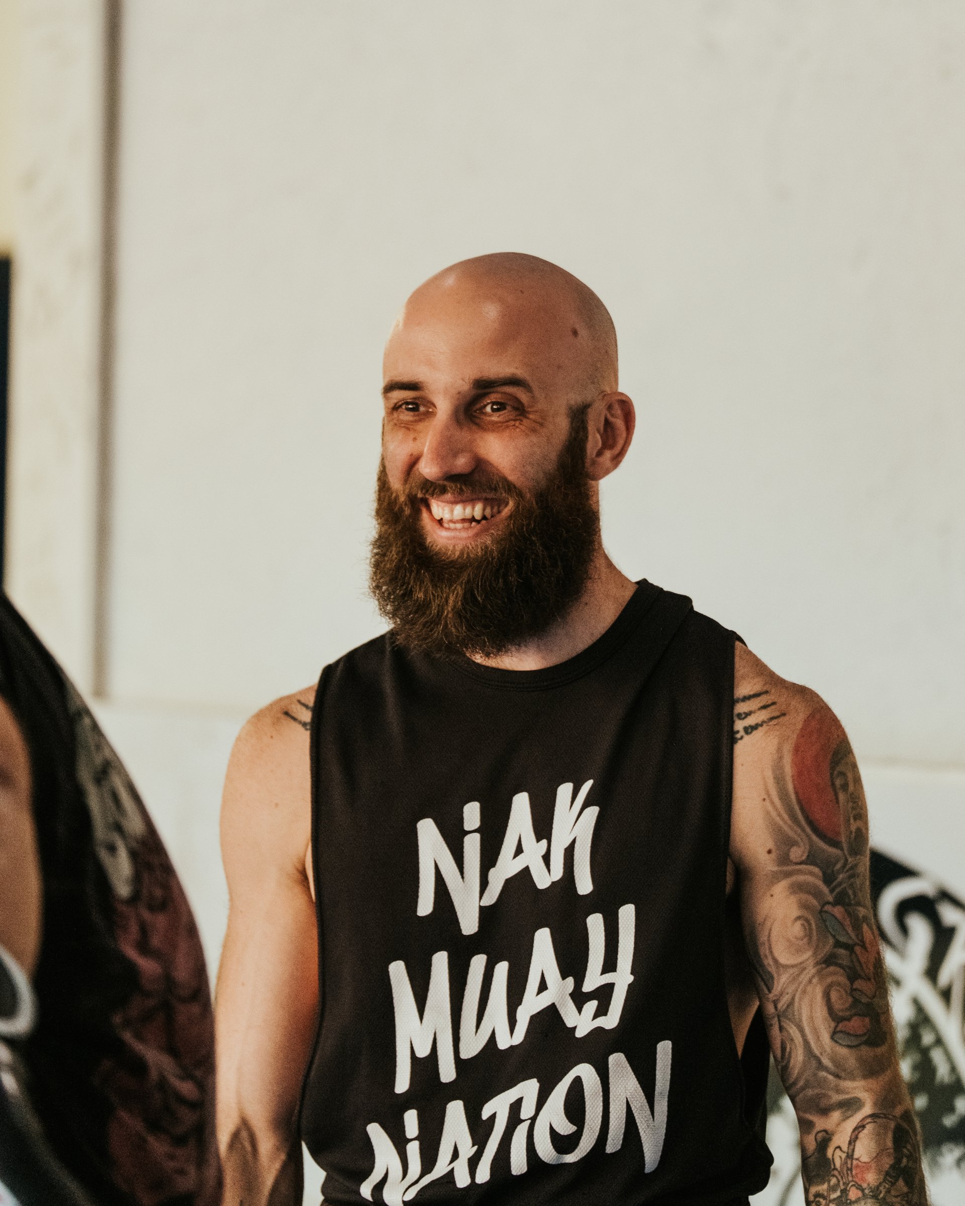 Sean Fagan smiling in a Nak Muay Nation tank