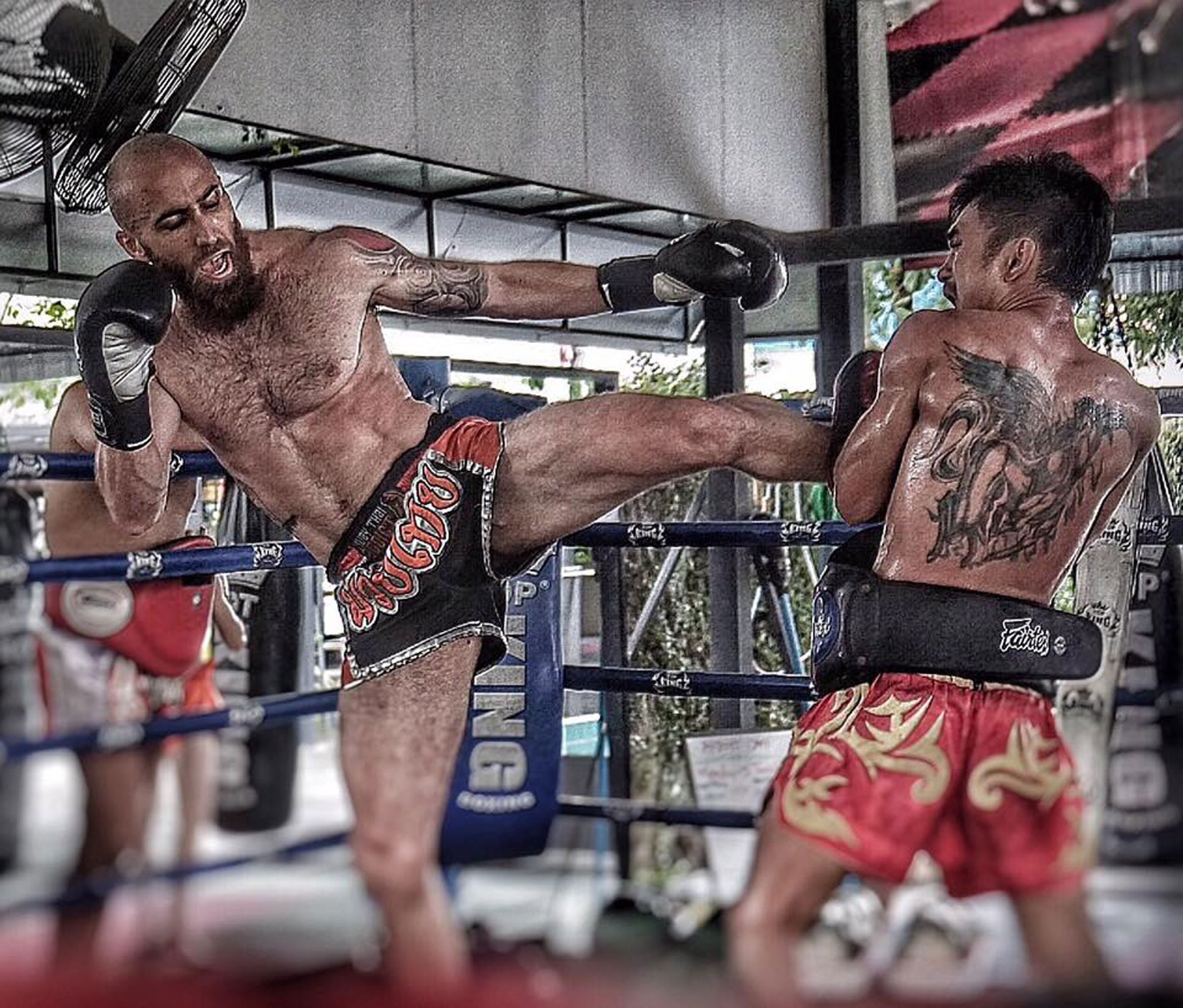 Sean working kicks in the ring