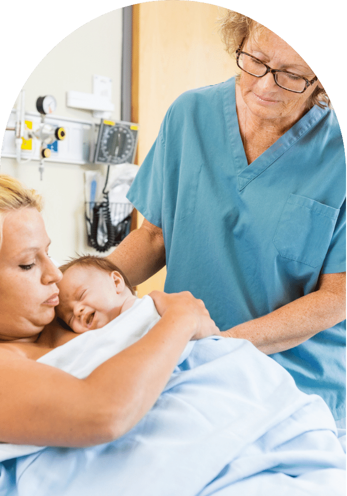 MIdwife with mother and newborn baby