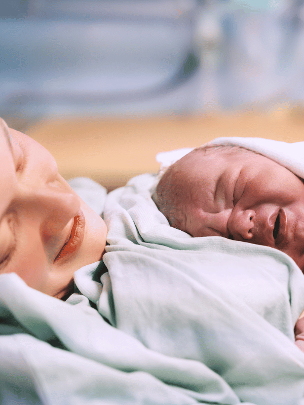 Mother and newborn. Child birth in maternity hospital Hypnobubs Cesarean Birth Online Course