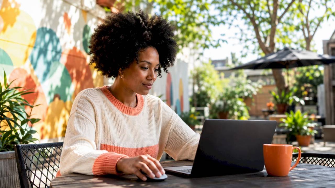 woman setting up automation workflow on a laptop