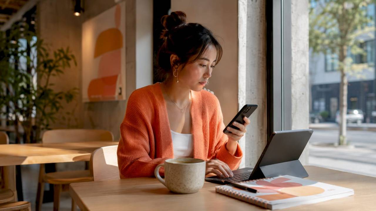 woman working on mobile first website design from home office