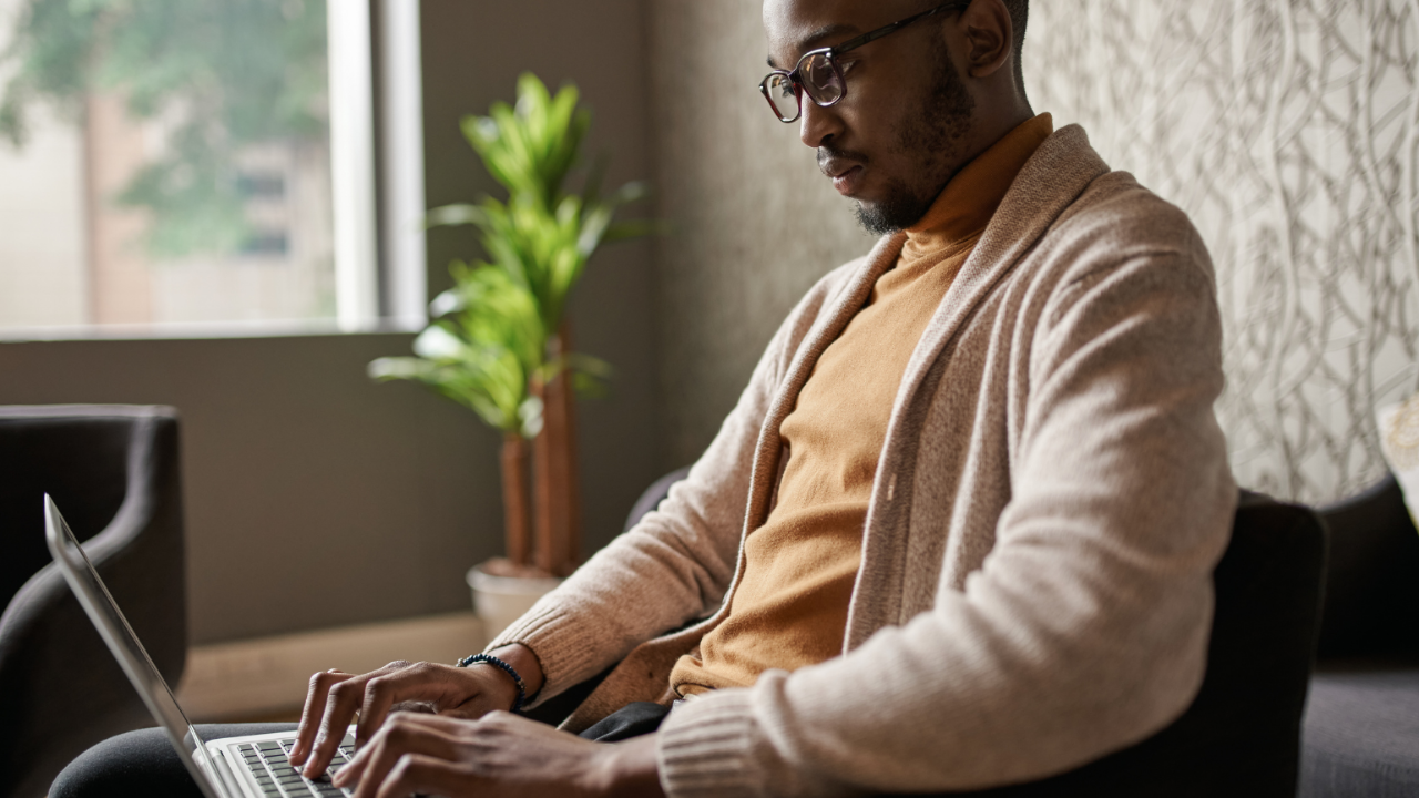 Older man working on laptop