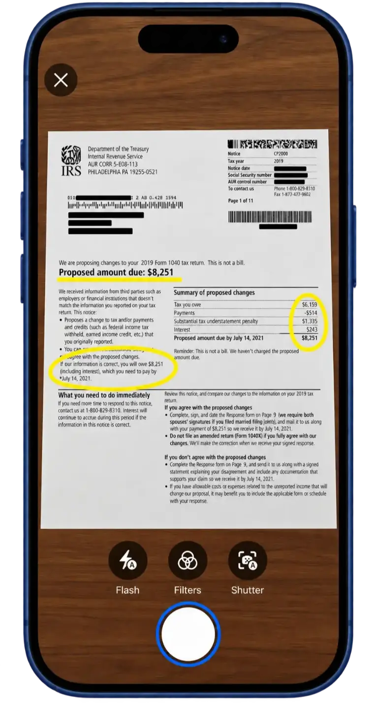 An IRS letter in the scanner view with the capture button highlighted.
