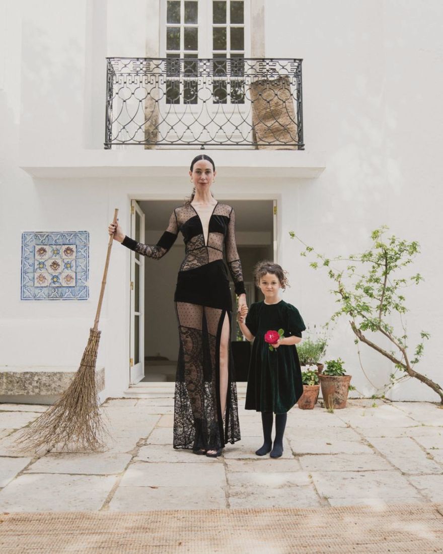 Georgiana and her daughter Rise holding hands