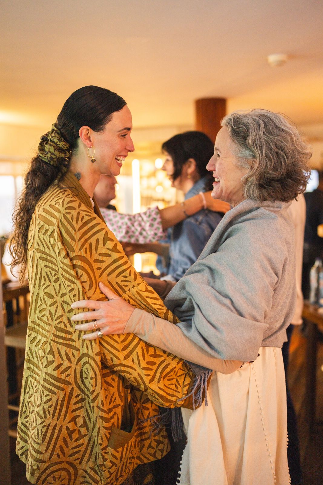 Georgiana embracing one of the women at the retreat