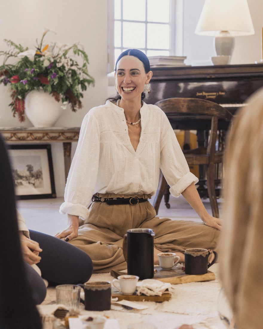 Georgiana laughing in the circle at the Women in Business retreat