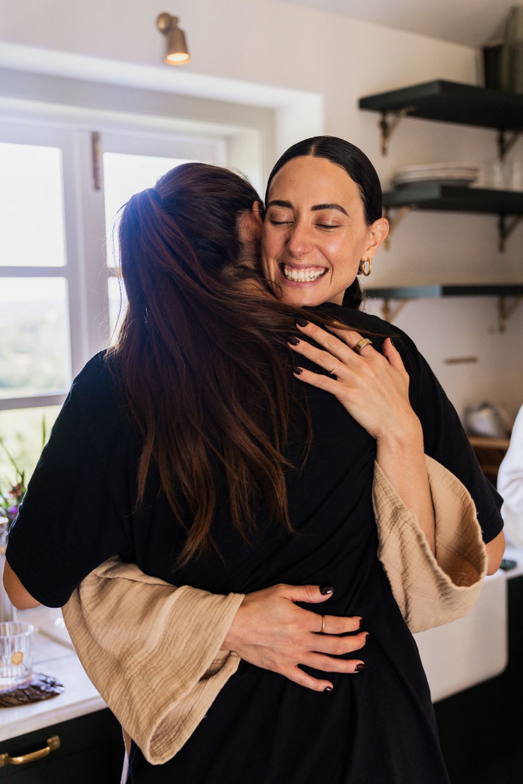 Two women hugging at the retreat