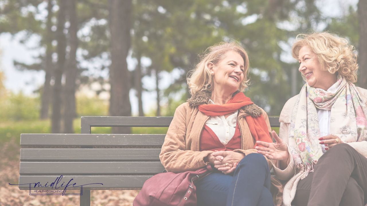 two women sitting and talking