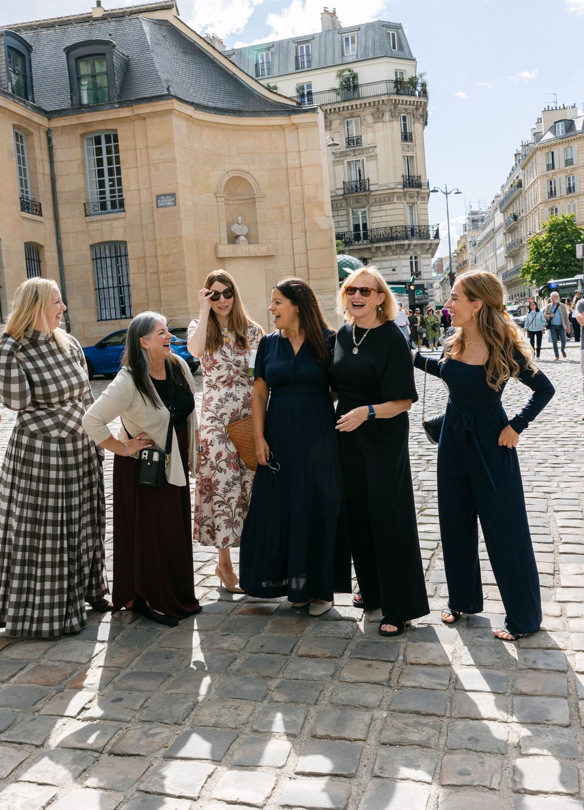 EDGE members laughing together on a Paris street