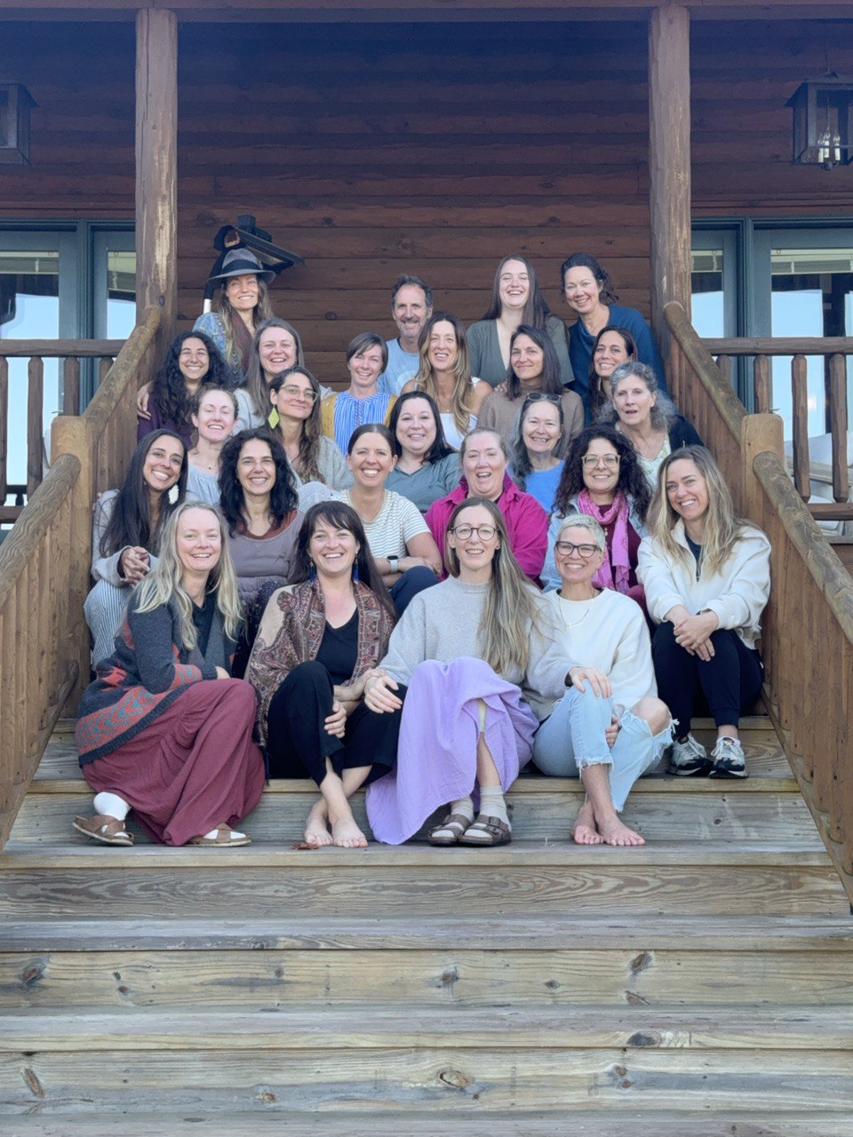A North America training group on the steps of the retreat lodge