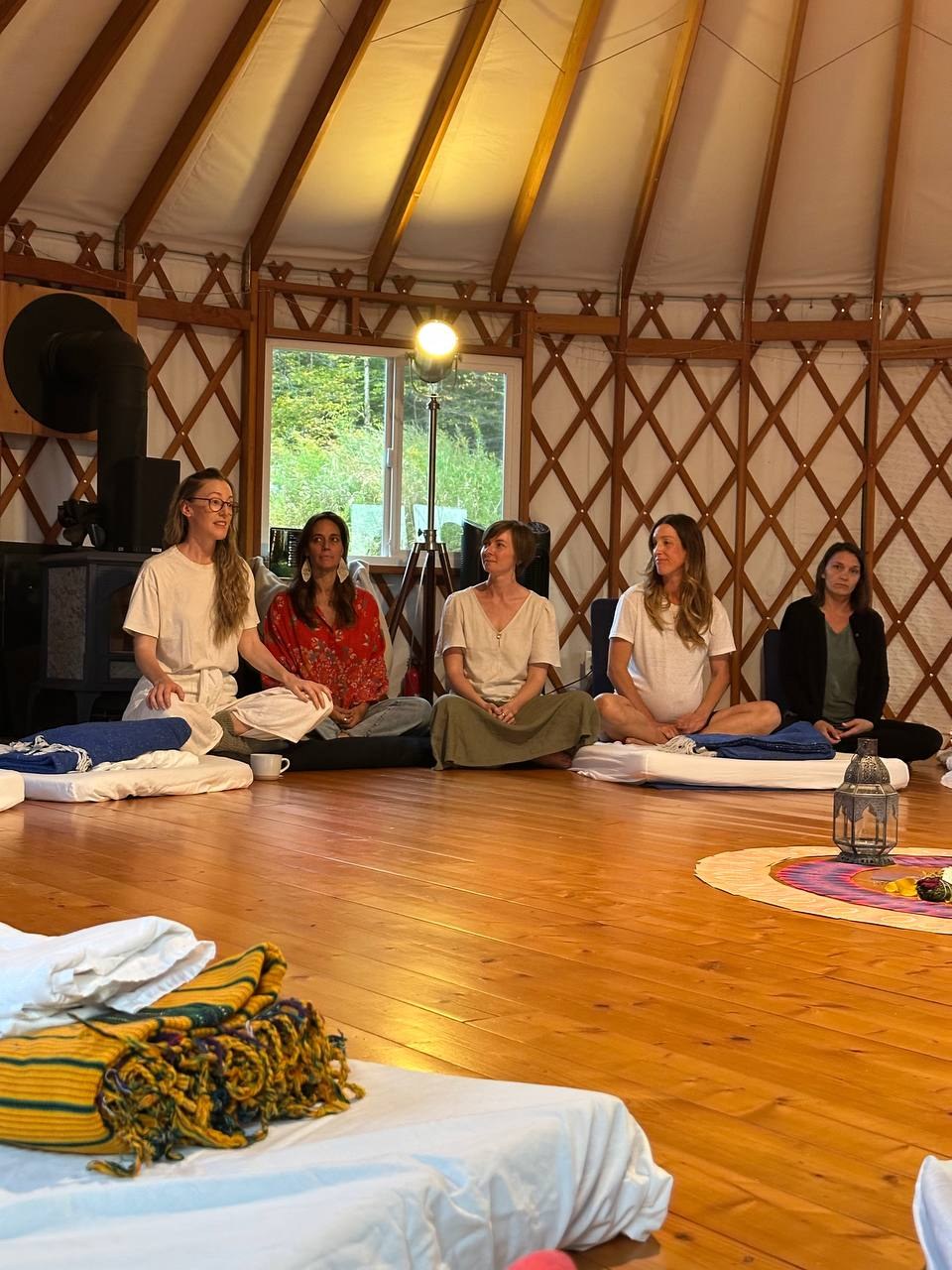 Sarah teaching a group in the yurt