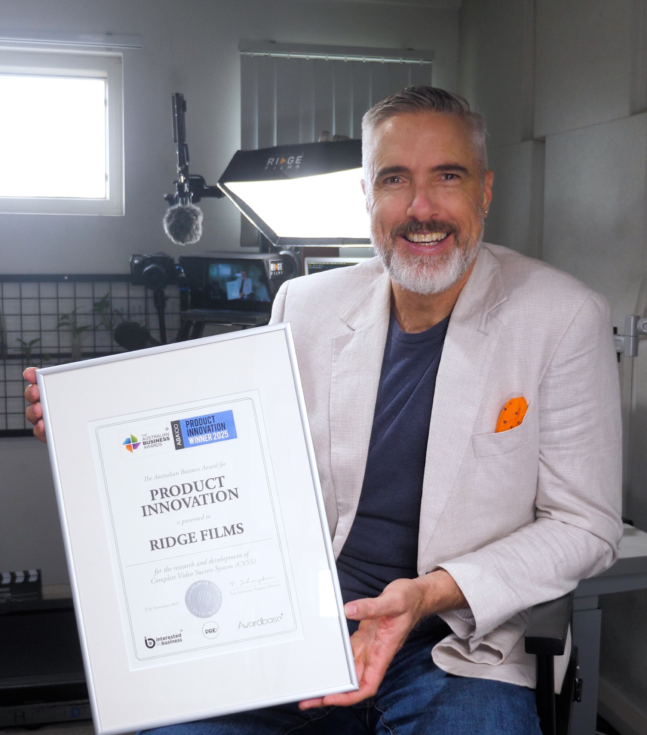 Chris Schwager holding the ABA100 Product Innovation 2025 certificate