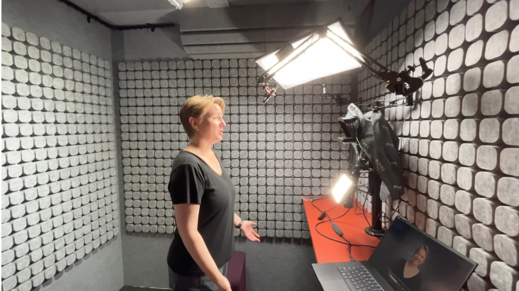 Heather Hukins after: recording inside an acoustic booth with the camera, prompter and lights fitted